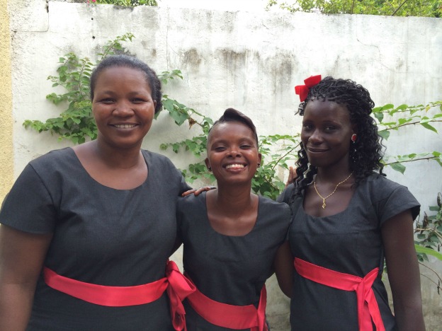 three graduates from The Salvation Army's vocational training in Haiti recieve certificates in plumbing.