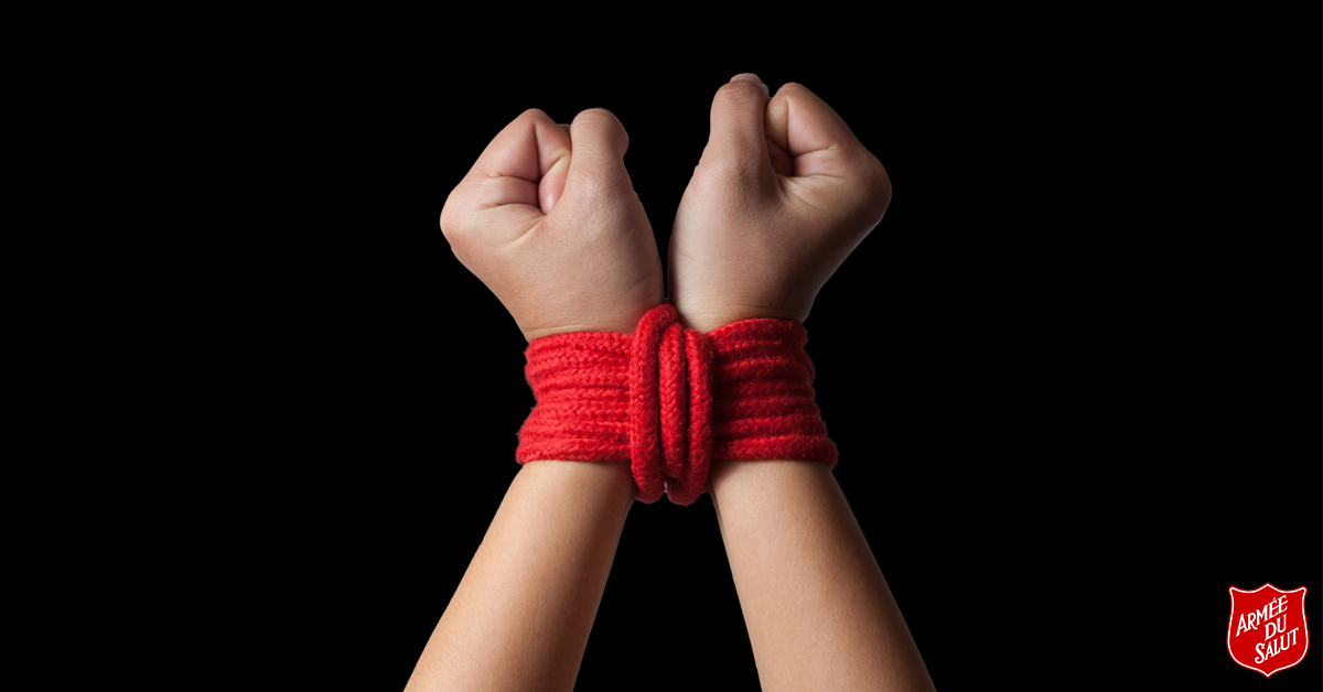 l’Armée du Salut- Deborah's gate. Hands tied together using red rope.